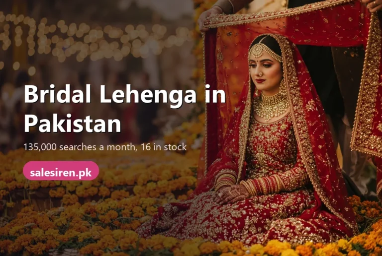 Bride in a deep red bridal lehenga with gold embroidery sitting at a barat stage